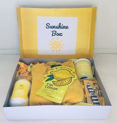 the sunshine box is packed with snacks and condiments