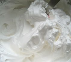 a large bowl filled with white whipped cream