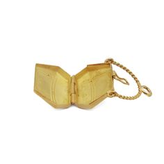 A fine vintage figural purse charm or pendant.  In 18k gold (with a light rose gold hue).  In the form of a purse or lady's handbag that opens with a hinge to the base and a snap closure that closes tightly.  Supported on a rope-twist, swing handle bail  allows this to be worn as a large charm in a charm bracelet or fixed with a jump ring to wear as a pendant necklace.   Marked to the bail with an assay mark.  Simply a wonderful high-level charm!  Date: 20th Century  Overall Condition: It is in overall good, as-pictured, used estate condition with some fine & light surface scratches and other signs of expected light wear consistent with age.  Fineness: Unmarked for gold fineness. Professionally tests at 18k.  Marks: Marked to the top of the bail with an assay mark.  Measurements: Width: ca Gold-tone Jewelry With Box Clasp For Gift, Gold Hinged Jewelry As Gift, Hinged Gold Jewelry As A Gift, Luxury Hinged Jewelry For Gifts, Antique Gold Openable Jewelry, Formal Compact Locket Jewelry, Antique Jewelry With Gold Clasp For Gifts, Compact Yellow Gold Jewelry For Formal Occasions, Rope Twist