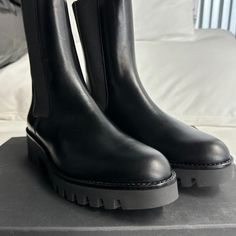 Size 9 Black Chelsea Boots With Lug Sole In Calf Leather, Black Calf Leather Chelsea Boots With Lug Sole, Black Leather Chelsea Boots With Textured Sole, Black Leather Chelsea Boots With Flat Heel, Designer Leather Chelsea Boots For Fall, Black Boots With Lug Sole, Elegant Black Boots With Vibram Sole, Black Chelsea Boots With Lug Sole For Formal Occasions, Designer Black Chelsea Boots For Fall