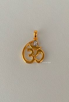 PENDANT INFO Metal: Any color 14k gold. Weight of Pendant: 2.80 grams Stone Type: Diamond Stone Shape: Round Diamond Weight : .03 ctw Length Of Om Not Including Bail: 15.18mm Width Of Om: 13.82mm Customizable: Yes, we can make this pendant in in any metal and with any gems. Chain: You have the two options below listed. But you may also inquire for another chain in any style and length. BOX CHAIN INFO Metal: 14kt Yellow Gold Weight of chain: 2.60grams Type of chain: 1.00mm Box Chain Type of clasp Gold Jewelry With Diamond Accents, 22k Gold Jewelry With Diamond Accents, Ayurveda Books, Om Pendant, Traditional Blouse Designs, Gold Mangalsutra Designs, Gold Mangalsutra, Amethyst And Diamond Ring, Mangalsutra Designs