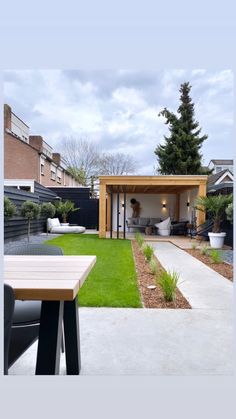 an image of a small backyard with grass