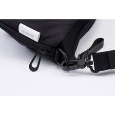 The ORNE is designed to follow and interact with the form of your silhouette. A playful twist in the material at the base of the bag creates a sense of movement and produces interesting folds in the fabric. The zippered ADDA shoulder strap can be worn separately as a minimal crossbody bag. Made from a smooth black Nylon and Polyester blend in black. [Details] Composition: 63% Polyester, 37% Nylon Height: 51cm Width: 42cm Depth: 0cm Color: Black Shape: Slingbag Features: Water Resistant, Expandab All Black Everything, Black Cross Body Bag, Black Nylons, All Black, New Product, Water Resistant, Crossbody Bag, Shoulder Strap, Bag Accessories