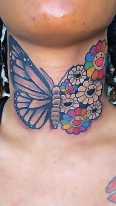 a woman with a butterfly tattoo on her neck