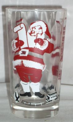 a shot glass with santa clause on it