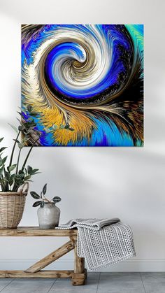 an abstract painting with blue, yellow and white swirls on the wall above a table