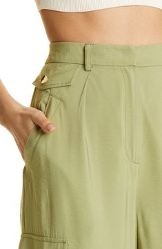 Cargo-style pockets lend practical appeal to high-waist pants kept free-flowing with a wide-leg silhouette. 34" inseam; 26" leg opening; 14 1/2" front rise; 18" back rise (size 8) 83% rayon, 17% nylon Dry clean Imported Green Wide-leg Bottoms With Patch Pockets, Green Wide Leg Bottoms With Patch Pockets, Spring Wide-leg Pants With Cargo Pockets, Spring Workwear Wide Leg Pants With Cargo Pockets, Spring Wide Leg Pants With Cargo Pockets For Work, Summer High Waist Wide Leg Pants With Side Pockets, Spring Wide Leg Cargo Pants With Patch Pockets, Versatile Wide Leg Culottes With Pockets, Chic Relaxed Fit Wide Leg Pants With Cargo Pockets