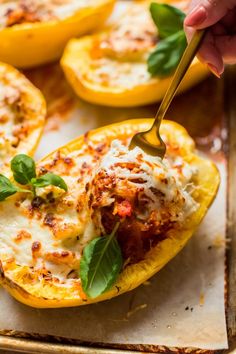 someone is spooning some food out of a stuffed bell peppers