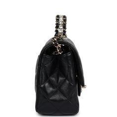 This Mini Rectangular flap bag is in black lambskin with light gold tone hardware and has a front flap with signature CC turnlock closure, rear half moon pocket, a faux crystal and black leather top handle and single interwoven black leather and light gold tone chain link shoulder/crossbody strap.The interior is lined in black leather and features a zipper pocket with Chanel pull and an open pocket below.Collection: 23A (RFID Chip)Origin: ItalyCondition: New and never worn (plastic on hardware)Accompanied by: Chanel box, Chanel dustbag, carebook, felt, RFID, retail UPC and ribbonMeasurements: 8" width x 5" height x 3" depth; 1.5" top handle, 20" strap drop Luxury Evening Flap Bag With Cc Turnlock Closure, Timeless Evening Flap Bag With Cc Turnlock Closure, Luxury Bag With Silver-tone Hardware And Double Flap, Luxury Bags With Silver-tone Hardware And Double Flap, Luxury Double Flap Bag With Silver-tone Hardware, Evening Flap Bag With Palladium Hardware, Evening Flap Bag With Cc Turnlock And Top Handle, Luxury Flap Bag With Cc Turnlock Closure For Travel, Luxury Shoulder Bag With Silver-tone Hardware And Flap