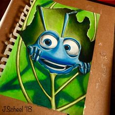 a drawing of a blue bug on a green leaf