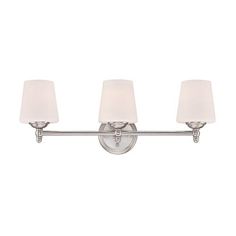 three light bathroom fixture in chrome finish with white linen shades on the glass and metal frame