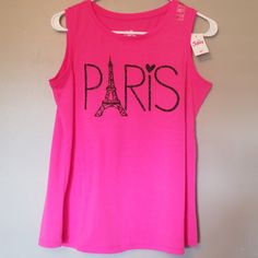 Nwt Bright Pink Top From Justice For Girls Size 18/20. Black Sparkly Paris In Black. I Am A Size Medium Or Size 6/8 In Jean's & This Fits Me, So For A Older Child Or For A Grownup It Is Like A Small Medium In Adults. No Trades. I Offer 15% Off Of 4 Of My Listings, Other Than That My Prices Are Firm. Thank You! Casual Pink Sleeveless T-shirt, Pink Graphic Print Crew Neck Tank Top, Spring Pink Letter Print Tank Top, Pink Crew Neck Tank Top With Graphic Print, Pink Sleeveless T-shirt With Graphic Print, Cute Pink Letter Print Tank Top, Pink Graphic Print Tank Top For Spring, Casual Pink Letter Print Tank Top, Casual Pink Tank Top With Letter Print