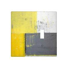 a light switch cover with yellow, grey and white paint