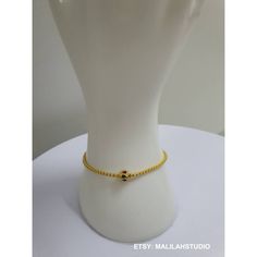 This exquisite chain bracelet is a handmade ethnic. Thai piece of jewelry made from yellow gold plated brass with tiny and cute bead enamel. The bracelet is perfect gift for all occasions. The unique design and style of this bracelet make it suitable for women of all ages. The bracelet is made in Thailand and is perfect for those who loves ethnic, regional, and tribal jewelry. Material: Brass gold plated23K with enamel Color : Yellow Gold  Weight : 45.48 grams Size: 6.5 inches, 7 inches, 7.5 inches Quantity : 1 pc You will receive : gold case, gift bag, wishes card Handmade, Exquisite craftsmanship Note to buyer: >The picture is enlarged. Please check the size and consider from the illustrations. >The necklace is delicate necklace. You may use it with special care. >The price do not cover Handmade Gold-plated Beaded Bracelets, Adjustable Tiny Beads Gold-plated Jewelry, Yellow Gold Beaded Chain Bracelet As Gift, Handmade Yellow Gold Plated Beaded Bracelets, Handmade Gold Bracelet With Round Beads, Dainty Handmade Gold Beaded Bracelets, Gold Plated Gold Beads Bracelet Gift, Gold Plated Bracelet With Gold Beads For Gift, Spiritual Gold Jewelry With Tiny Beads