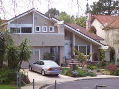 a car is parked in front of a house