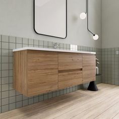 a bathroom with a sink, mirror and wooden cabinet in it's center area