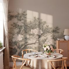 a dining room table with flowers on it