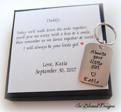 a keychain with a message attached to it sitting on top of a card