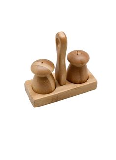 a wooden toy with two mushrooms on it