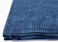 the blue and white checkered fabric is folded up