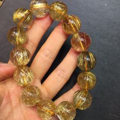 Material:Rutilated Quartz Gemstone size : Approx 16mm   quantity: one strand  6mm -apporx 62pcs beads 8mm -apporx 47pcs beads 10mm -apporx 37pcs beads 12mm -apporx 32pcs beads 14mm -apporx 28pcs beads 16mm -apporx 22pcs beads 18mm -apporx 20pcs beads 20mm -apporx 18pcs beads Energy Stones, Stone Bracelet, Beaded Bracelets