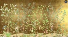 an image of a painting with flowers and plants on it's side, in gold