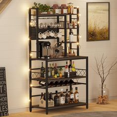 a shelf filled with bottles and glasses on top of a wooden floor