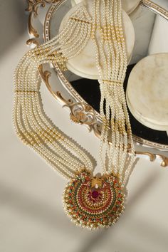 Step into the realm of timelessness with the "Inza - Mala Necklace & Tikka Set." This set embodies distinct style, intricacy, and craftsmanship reminiscent of a bygone era, adding a touch of enchantment to your ensemble.Adorn yourself with charisma as you wear this talismanic set adorned with ethereal stones and the grace of pearl moti, all while radiating the traditional and aesthetic identity. This set includes a long mala necklace and a pair of stunning earrings, each designed to capture the Ear Chain, Accessories Ear, Jewelry Styles, Chandbali Earrings, Pakistani Jewelry, Choker Necklace Set, Bygone Era, Jhumka Earrings, Mala Necklace