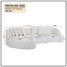 a white couch with pillows and measurements for the back side, including the seat height