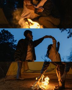 two people sitting around a campfire at night and one person standing in front of the fire