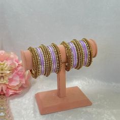 This includes 2 half stacks of lilac bangle set includes antique gold mixed with lilac dot metal bangles.  Avialable in 12 different colours to choose from ✨ Ready to ship 📦 Festive Purple Bangle, Purple Bangle For Wedding, Traditional Purple Bangle Bracelets, Traditional Adjustable Purple Bangle, Traditional Purple Bracelets For Festive Occasions, Traditional Purple Bracelet For Festive Occasions, Traditional Purple Bangle For Festive Occasions, Festive Traditional Purple Bangle, Adjustable Purple Round Bangle