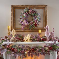 a fireplace decorated for christmas with wreaths and ornaments