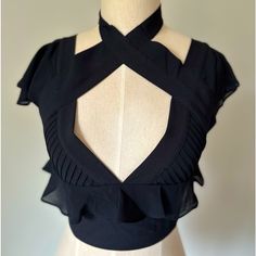 Nasty Gal Black Ruffle Zip-Up Gunmetal Black Back Zipper Ruffle Shoulders And Neckline Nwot Clasp Closure At Neck, One Became Detached As I Was Dressing The Mannequin, But I Have It. Will Try To Get It Sewed On! Size Xs Goth Cleavage Black Cropped Ruffle Crop Top, Black Ruffled Crop Top, Elegant Black Cropped Top, Chic Evening Crop Top With Ruffles, Elegant Black Crop Top, Fitted Ruffles Crop Top For Party, Fitted Ruffled Crop Top For Evening, Fitted V-neck Crop Top With Ruffles, Fitted V-neck Ruffle Crop Top