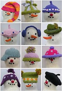 many different knitted snowmen wearing hats and scarves