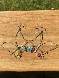 Lightweight and handmadebutterfly earrings! I'd love to make a personalized pair for you! Multicolor Butterfly Earrings, Whimsical Butterfly Earrings With Ear Wire, Nickel-free Adjustable Butterfly Earrings, Handmade Multicolor Butterfly Earrings, Multicolor Butterfly Charm Earrings, Multicolor Butterfly Charm Earrings As Gift, Unique Butterfly Earrings For Jewelry Making, Unique Nickel-free Butterfly Earrings, Wire Butterfly