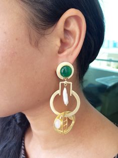 Long Oversized Green Fashion Gold Designer Statement Earrings, Party Earrings Specifications of these earrings  Gemstone  - Natural Onyx Color  - White - Green Length  - 3.5 inches approx  ** IMPORTANT POINTS TO NOTE ABOUT THIS PRODUCT -  - These are made in brass with 22k  gold plating. They should not be exposed to any kind of chemicals or perfumes, chlorine water or normal water. They should be stored in a closed box when not in use for a long life.  - If you have sensitive ear lobes and want Heavy Elegant Green Earrings, Emerald Statement Earrings, Luxury Festive Green Earrings, Nice White Dresses, Luxury Ornate Green Earrings, Luxury Green Brass Earrings, Style Vert, Semi Formal Wear, Onyx Colour