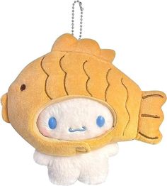 a stuffed toy with a fish on it's head hanging from a metal chain