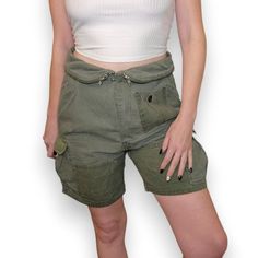 Brand: Isabel Marant Descrip: Army Green Foldover Cargo Shorts Size: 1 ((Small)) Approx Msmts: Flat Waist: 16" Inseam: 6" Rise: 12" Fabric: 100% Cotton Condition: Pre-Owned, Very Good No Notable Flaws Model Fits Many Sizes But Typically 4-6/27-28 In Pants. M In Tops, 34c. 5’5” Will Ship Within 1-2 Biz Days Reasonable Offers & Bundles Welcome! Army Zipper Waist Detail Olive Green Shorts Summer Preppy Cargo Short Women, Military Shorts, Olive Green Shorts, Preppy Summer, Shorts Summer, Model Fits, Green Shorts, Summer Shorts, Isabel Marant