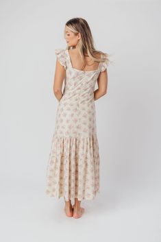 Whether you're frolicking through a field of wildflowers, touring a sunny Greek isle, or attending a springtime baby shower, the Emery Midi Dress will ensure you do it looking like a goddess. We designed this premium dress with an ultra-flattering neckline and a figure-skimming silhouette, paired with a flounced skirt and sweet ruffle details. The Emery is guaranteed to be one of your most feminine (and most favorite!) pieces. FIT: Runs very fitted. This dress is designed with a fit-and-flare profile, and is fitted through the waist and hips. Fabric does not stretch, so we recommend sizing up for more room in the hips MATERIAL: Self: 75% Rayon, 25% Nylon; Lining: 100% Cotton. GARMENT DETAILS: Lightweight summer dress in a long midi length and pastel floral print chiffon. Features a square Spring Bohemian Maxi Dress With Ditsy Floral Print, Bohemian Ditsy Floral Print Maxi Dress For Spring, Feminine Spring Maxi Dress For Garden Party, Bohemian Maxi Dress With Ditsy Floral Print For Spring, Feminine Maxi Dress For Garden Party In Spring, Bohemian Ditsy Floral Maxi Dress For Garden Party, Summer Style Maxi Dress For Spring Garden Party, Maxi Sundress With Ditsy Floral Print For Brunch, Cottagecore Square Neck Dress With Ditsy Floral Print