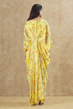 Yellow georgette kaftan with floral print and sequins and beaded hand embroidered placement patchwork. Comes with an inner.
Components: 2
Pattern: Printed, Hand embroidered
Type Of Work: Floral, Sequins, Beads
Neckline: V Neck
Sleeve Type: Kaftan : Flared Sleeves, Inner : Sleeveless
Fabric: Georgette
Color: Yellow
Other Details: 
Front pleats
Occasion: Sangeet - Aza Fashions Georgette Kaftan, V Neck Kaftan, Beaded Neckline, Fashion App, Flared Sleeves, Aza Fashion, Sleeve Type, Hand Embroidered, Types Of Sleeves