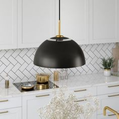 Clean lines and a mid-century modern design combine to create this unique pendant light fixture. The 16" wide round shade features cut-outs along the top so light can reflect up towards your ceiling as well as through the traditional downlight. The adjustable 8 foot cord allows you to hang the pendant at your desired height. Its unique design sets this pendant apart and is sure to be an eye-catching statement piece in your foyer, kitchen, or dining room. | Hinkley & Carter Jordyn Pendant Unique Pendant Lights, Cfl Bulbs, Black Pendant Light, Home Decor Lights, Unique Pendant, Brass Pendant, Mid Century Modern Design, Chandelier Pendant Lights, Brushed Brass