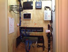 there are many wires and electronic devices on the wall