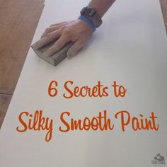 a person's hand on top of a sheet of paper with the words 6 secrets to silky smooth paint