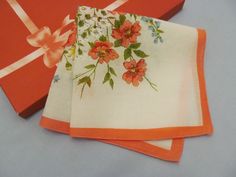 This is an attractive floral hankie. The large bouquet in the center contains pink, blue, white and yellow flowers, with three red and pink roses in the center. The background is white.  There is a narrow pink border (which has been printed a little unevenly) and the edge is machine-stitched.  This is a vintage linen handkerchief, measuring 13 inches square. It has been washed and ironed, and is very good condition.  Future care is easy - it can be machine-washed and machine-dried, and then pres Pink Handkerchiefs For Summer Gifts, Summer White Handkerchiefs Gift, White Handkerchiefs As Spring Gifts, White Handkerchiefs For Spring Gifts, Spring Gift White Handkerchiefs, White Flower Shaped Handkerchiefs For Spring, Pink Spring Handkerchiefs For Gifts, Vintage Summer Handkerchiefs As Gift, Vintage Handkerchiefs For Spring Gift