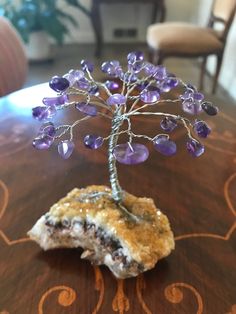 I handmade this Gemstone Tree of Life with genuine amethyst stones for the leaves & silver wire for the trunk & branches & a genuine natural sparkling Citrine Druzy Rock for the base. Amethyst brings such peaceful & calming loving vibes and Citrine brings much abundance. 💜 Height of whole thing is about 4 inches **you get the exact piece shown in the photos. It is a one of a kind. 😊 I tried to take pics in different lighting. These stones have such great healing properties....I hope it will br Purple Natural Stones Crystals As A Gift, Handmade Spiritual Amethyst Gemstones, Unique Amethyst Gemstones For Gifts, Lavender Amethyst Crystals As A Gift, Lavender Amethyst Crystals For Gift, Handmade Spiritual Tumbled Crystals, Handmade Lavender Crystals For Spiritual Use, Handmade Lavender Spiritual Crystals, Handmade Silver Amethyst Crystals