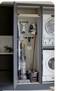 the inside of a cabinet is full of cleaning supplies and tools, including a vacuum cleaner