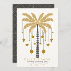 a palm tree with ornaments hanging from it's trunk and the words deck the palms