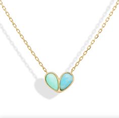 A modern take on a heart design, the sweetheart necklace is the perfect personalized style. Customize with your favorite color or gemstones of your choice. Available in 18K Yellow Gold Chain length = 16in with a 14.5in option Pendant = 15 x 10mm Colored stones are natural and color may slightly vary Certain gemstones are cabochon cut or faceted cut For custom orders please contact info@stephaniegottlieb.com This item is FINAL SALE Elegant Turquoise Heart Necklace For Gift, Elegant Turquoise Necklace With Heart Charm, Elegant Heart-shaped Turquoise Necklace, Candy Buttons, Bubble Necklaces, Holiday Sparkle, Colored Stones, Everyday Necklace, Modern Necklaces