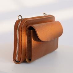 This elegant, genuine Italian leather wallet comes with straps and is the perfect everyday purse. It holds all of your essentials, is cute, and goes with phone pocket. DETAILS:  .: Genuine leather wallet bag  .: Strap included   .: Made in Italy  .: Hand made  .: Strap is adjustable from 23 to 45 inches.  Dimensions 8x4 inch , it's enough space for money, cards, mobile phone. SHIPPING .: Once your order is placed, you can expect your package will be shipped within 1-3 business days  .: Our store is located in Texas, and all items are shipped out of Texas CARE: .: To keep your wallet lasting longer treat it like your skin.) You can wash it, but do not overdry with soap.  Do not machine wash or tumble dry. Anyway natural skin is always strong and durable. MORE: Return: You can make a return Versatile Brown Wallet With Removable Pouch, Everyday Leather Phone Bag With Card Slots, Versatile Brown Wallet With Mobile Phone Bag, Wallet On Chain With Card Slots Clutch, Everyday Wallets With Mobile Phone Pouch, Versatile Leather Wallet With Cell Phone Pocket, Versatile Leather Phone Bag With Card Slots, Versatile Brown Phone Bag With Interior Card Slots, Everyday Leather Wallet With Mobile Phone Bag