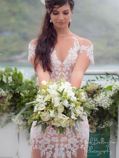 a woman in a wedding dress holding a bouquet